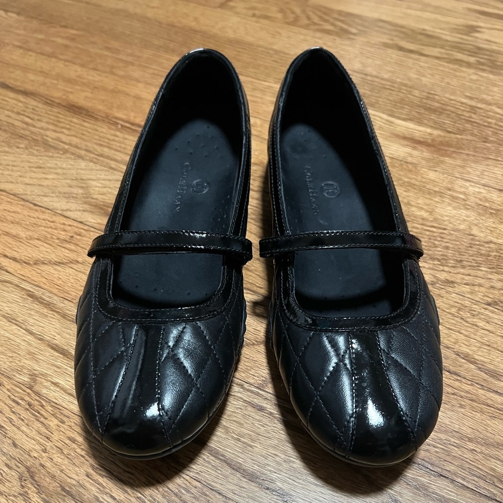 Cole Haan black Mary Janes.